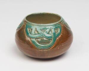 Marguerite Mahood (1901-1989) A wheel thrown glazed earthenware pot decorated with a celtic knot