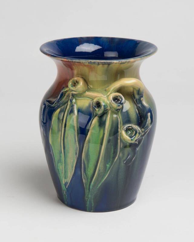 Remued Pottery A blue glazed earthenware vase with applied gumnuts and gum leaves