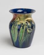 Remued Pottery A blue glazed earthenware vase with applied gumnuts and gum leaves