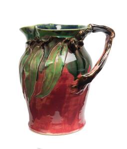 Remued Pottery A pink and green glazed gumnut and gum leaf decorated jug