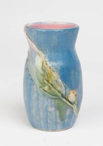 Philippa James (1893-1967) A glazed earthenware gumnut and gum leaf decorated vase with blue glaze