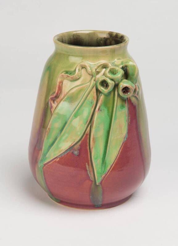 Remued Pottery A pink and green glazed earthenware vase with applied gumnuts and gum leaves