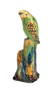 Grace Seccombe (1880-1956) A glazed earthenware figure of a yellow and green budgerigar