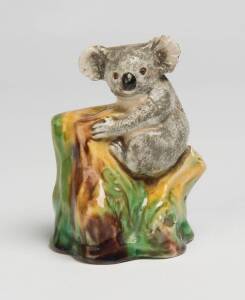 Grace Seccombe (1880-1956) A glazed earthenware figure of a koala on a bough