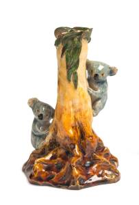 Grace Seccombe (1880-1956)A glazed earthenware figure of two koalas on a tree stump