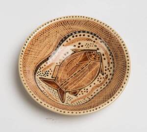 Carl Cooper (1917-1968) A wheel thrown glazed earthenware dish with sgraffito decoration of a fish