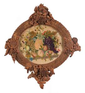 A handmade leather frame mirror with applied leaves, pods and native flora ​The central panel with embroidered wool work