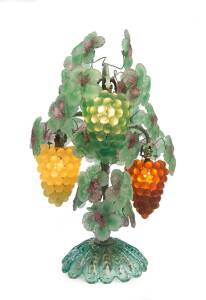 A three branch wrought iron and glass leaf and grape decorated table lamp, in the Murano style