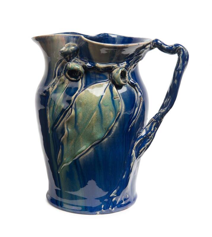 Remued Pottery A blue and green glazed gumnut and gum leaf decorated jug