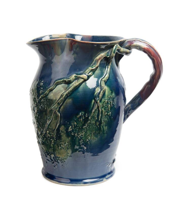 Remued Pottery A blue and green glazed branch decorated jug