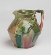 Remued Pottery A glazed earthenware jug with applied gumnuts and gum leaves