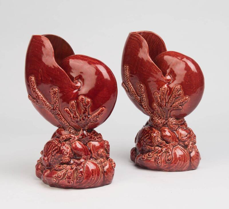 William Ferry (act. circa 1879-1921) A pair of slip cast hand-finished glazed earthenware red nautilus shells