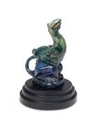 Marguerite Mahood, (1901-1989) A glazed earthenware figure of a blue winged dragon, circa 1935