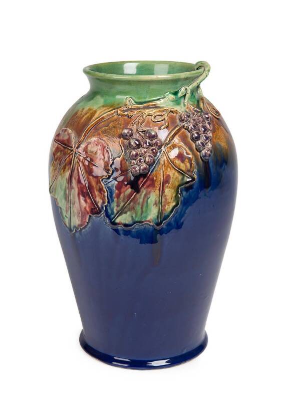 Premier Pottery David Dee, Margaret Kerr (decorator) A wheel thrown glazed earthenware vase with hand modelled and applied grape vine decoration c. 1930