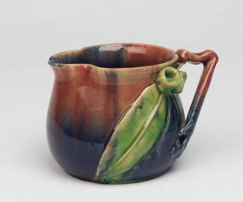 Remued Pottery A blue glazed earthenware jug with applied gumnuts and gum leaves