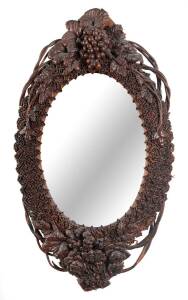 An Australian oval leather work wall mirror, 19th century