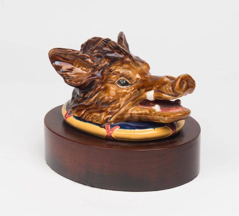 A glazed earthenware majolica boar head