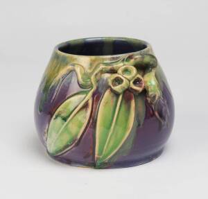 Remued Pottery A lavendar glazed earthenware vase with applied gumnuts and gum leaves