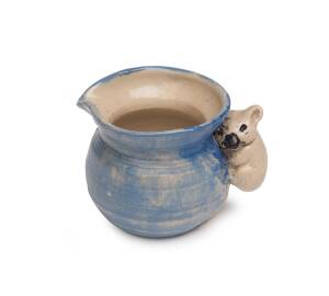 Philippa James (1893-1967) A miniature glazed earthenware jug moulded with a koala