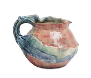 Philippa James (1893-1967) A glazed earthenware gumnut and gum leaf branch handled jug