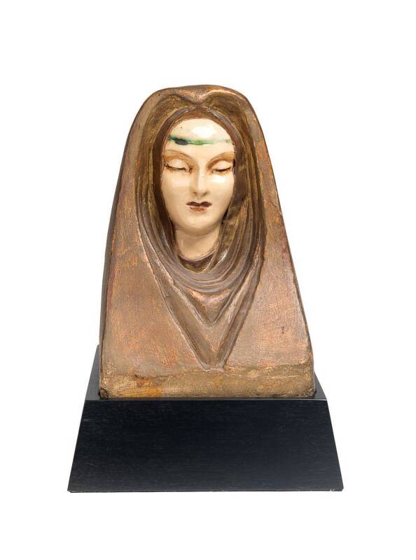 Marguerite Mahood (1901-1989) A hand modelled, glazed earthenware of a female mask, set within a cowl of bronzed plaster, c. 1936