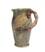 Remued Pottery An early gumnut and gum leaf branch handled jug 1933