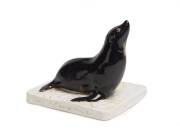 Grace Seccombe (1880-1956) A rare glazed earthenware figure of a seal