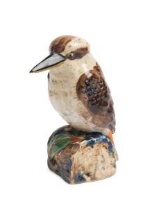 Grace Seccombe (1880-1956) A glazed earthenware figure of a kookaburra on a leaf decorated bough