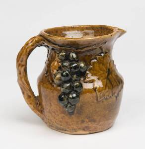 William Merric (Merric) Boyd (1888-1959) A glazed earthenware grape and leaf decorated jug