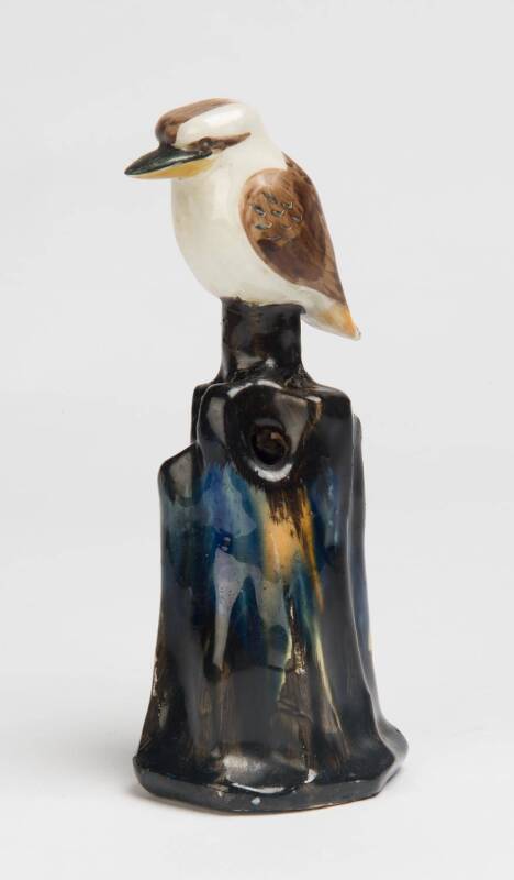 Grace Seccombe (1880-1956) A glazed earthenware figure of a kookaburra on a pierced flower frog base