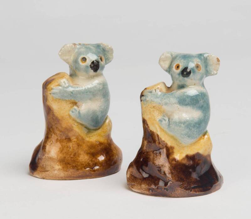 Grace Seccombe (1880-1956) A pair of glazed earthenware koala salt and pepper shakers