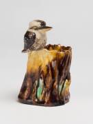 Grace Seccombe (1880-1956) A glazed earthenware bough vase with applied kookaburra