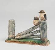 Grace Seccombe (1880-1956) A glazed earthenware figure of two kookaburras on a fence post