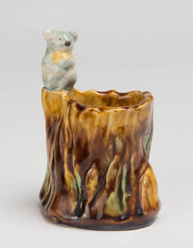 Grace Seccombe (1880-1956) A glazed earthenware bough pot with applied koala figure