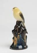 Grace Seccombe (1880-1956) A glazed earthenware figure of a canary