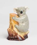 Grace Seccombe (1880-1956) A glazed earthenware figure of a koala on a bough