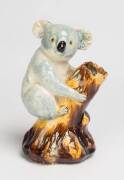 Grace Seccombe (1880-1956) "Billie Bluegum" A glazed earthenware crinkly eared koala