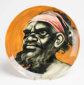 Martin Boyd (1923-1988) A slip cast glazed earthenware platter, hand decorated with an Aboriginal man's face