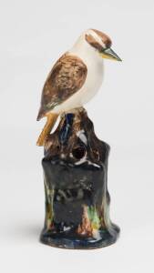 Grace Seccombe (1880-1956) A glazed earthenware figure of a kookaburra with a pierced flower frog base