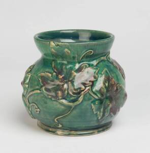 Alison Davidson (active 1933) A turquoise glazed earthenware vase with applied vine leaves