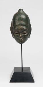 Ola Cohn (1892-1964) A patinated brass wall mask of gumnut fairy