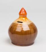 Remued Pottery A treacle glazed earthenware money box