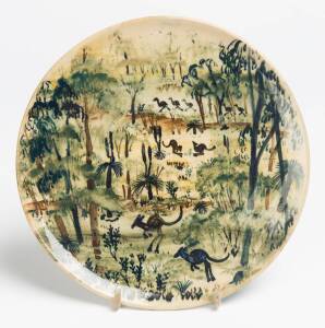 Arthur Merric Boyd (1920-1999) A wheel thrown glazed earthenware dish with underglaze decoration of a landscape with kangaroos, emu and grass trees