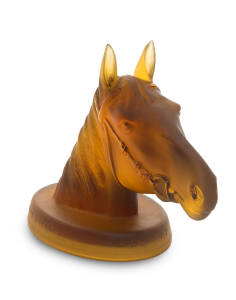 PHAR LAP: c1932 amber glass statue of Phar Lap's head, with text around base "Phar Lap/ 1928-32/ 37 Wins from 51 Starts", 13cm tall & 18cm long. Scarce and attractive.