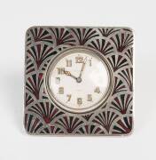 An Art Deco enameled nickel traveling clock