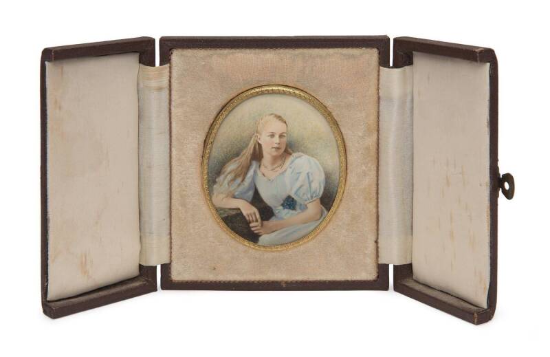 A miniature portrait painting in gilt metal oval frame, housed in embossed leather folding travel case, early 20th Century. Frame 6.5 x 7.5cm