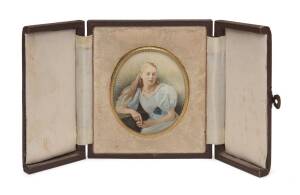 A miniature portrait painting in gilt metal oval frame, housed in embossed leather folding travel case, early 20th Century. Frame 6.5 x 7.5cm