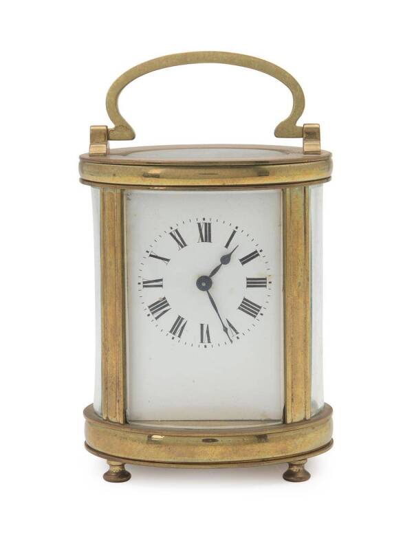 A French carriage clock in an oval shaped case, late 19th Century. 15cm