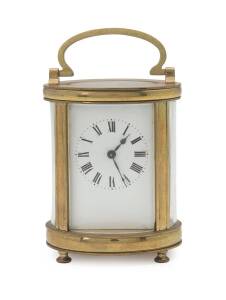 A French carriage clock in an oval shaped case, late 19th Century. 15cm