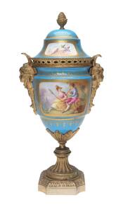 A Serves porcelain urn hand painted, with ormolu mounts, 19th Century. 33cm. 